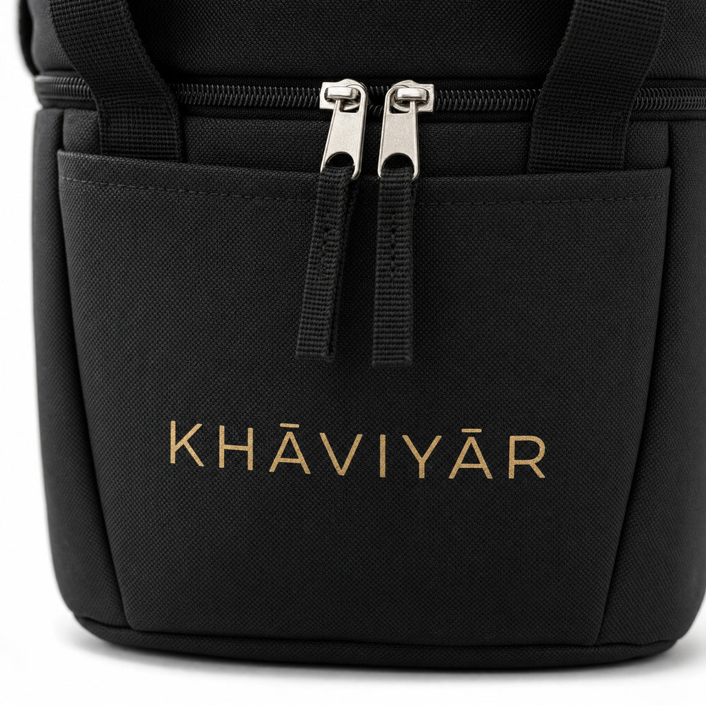 Close-up of the gold KHAVIYAR mark and zipper pulls on the Caspian Cooler Bag