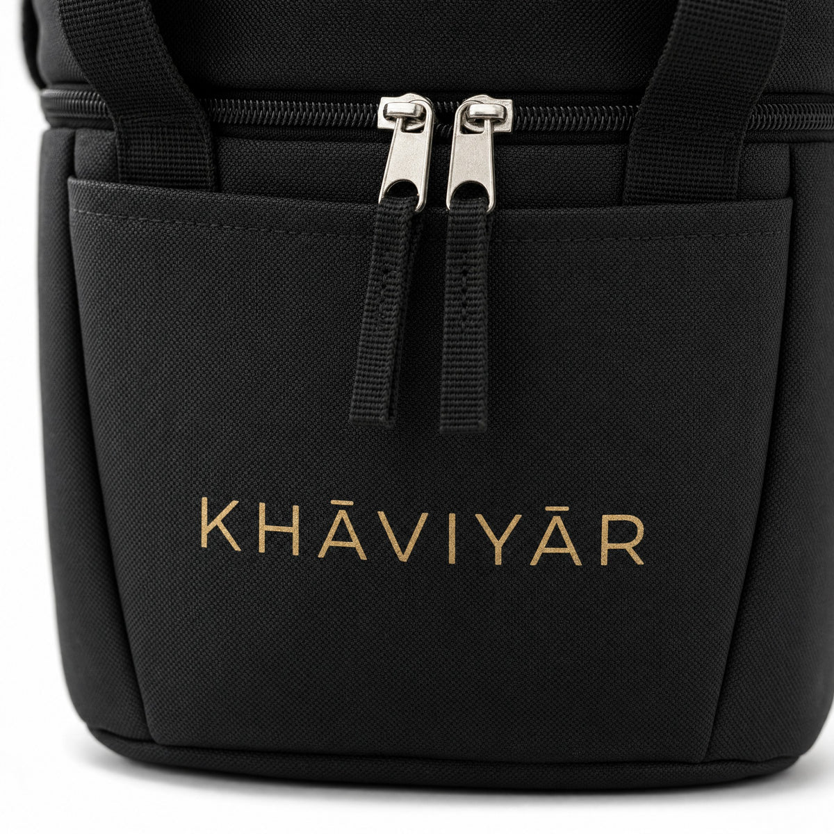 Close-up of the gold KHAVIYAR mark and zipper pulls on the Caspian Cooler Bag