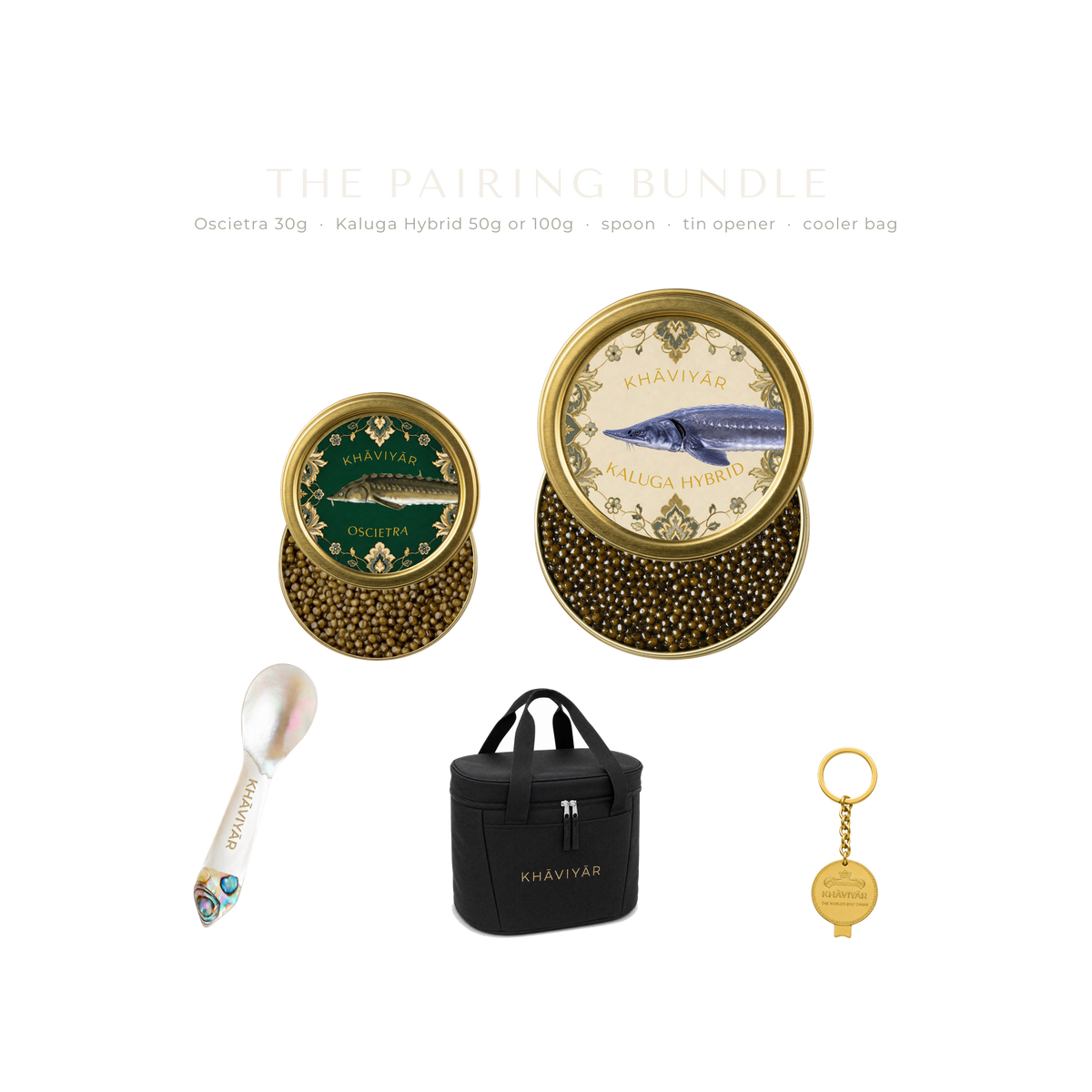 The KHAVIYAR pairing bundle line up: a small Oscietra tin, a larger Kaluga Hybrid tin, a mother of pearl caviar spoon, the bespoke tin opener keychain and the Caspian Cooler Bag.
